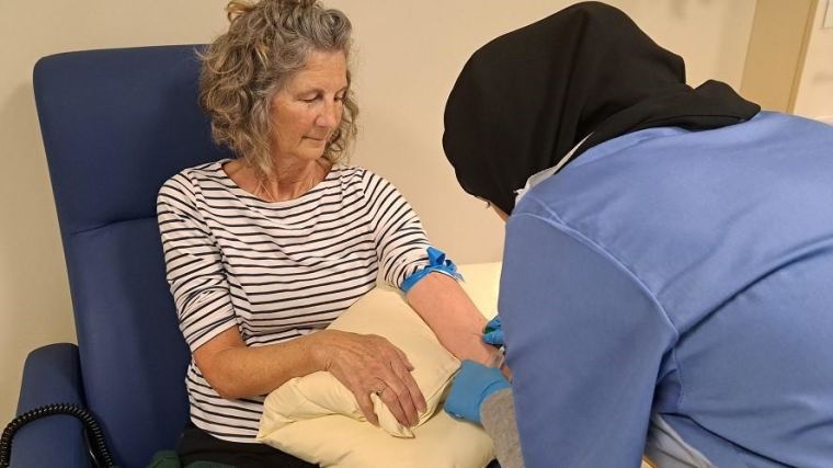 A woman having her blood taken