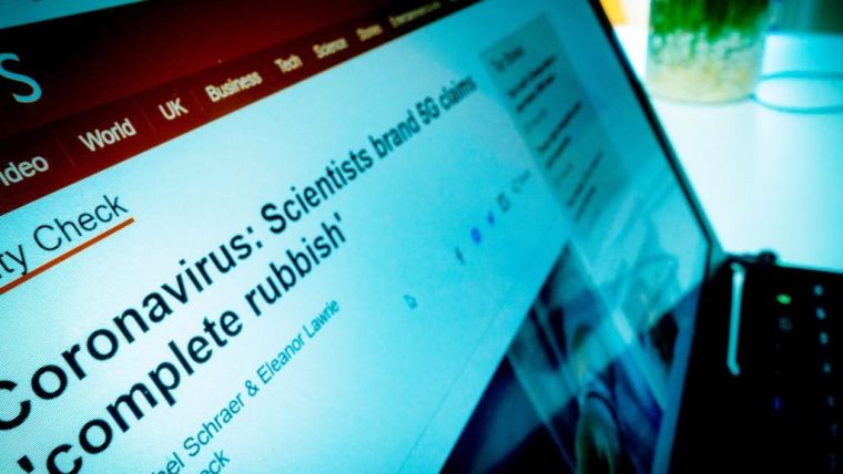 Image of laptop displaying the BBC NEWS headline: 'coronavirus: Scientists brand 5G claims "Complete rubbish" '