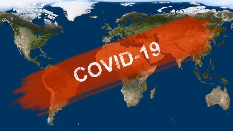 Inscription COVID-19 on global satellite map.